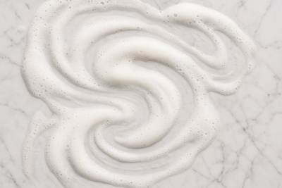 shampoo foam on a white marble background